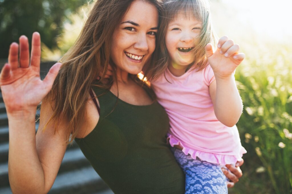 Little girl with special needs enjoy spending time with mother
